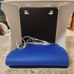 Blue Laptop Sleeve with White Charging Cable